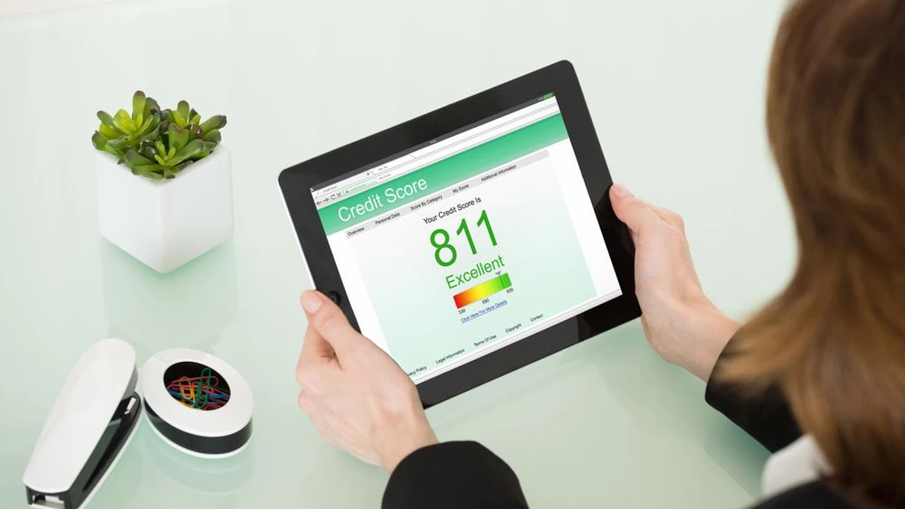 Two mint chocolate milkshakes with whipped cream and green sprinkles.