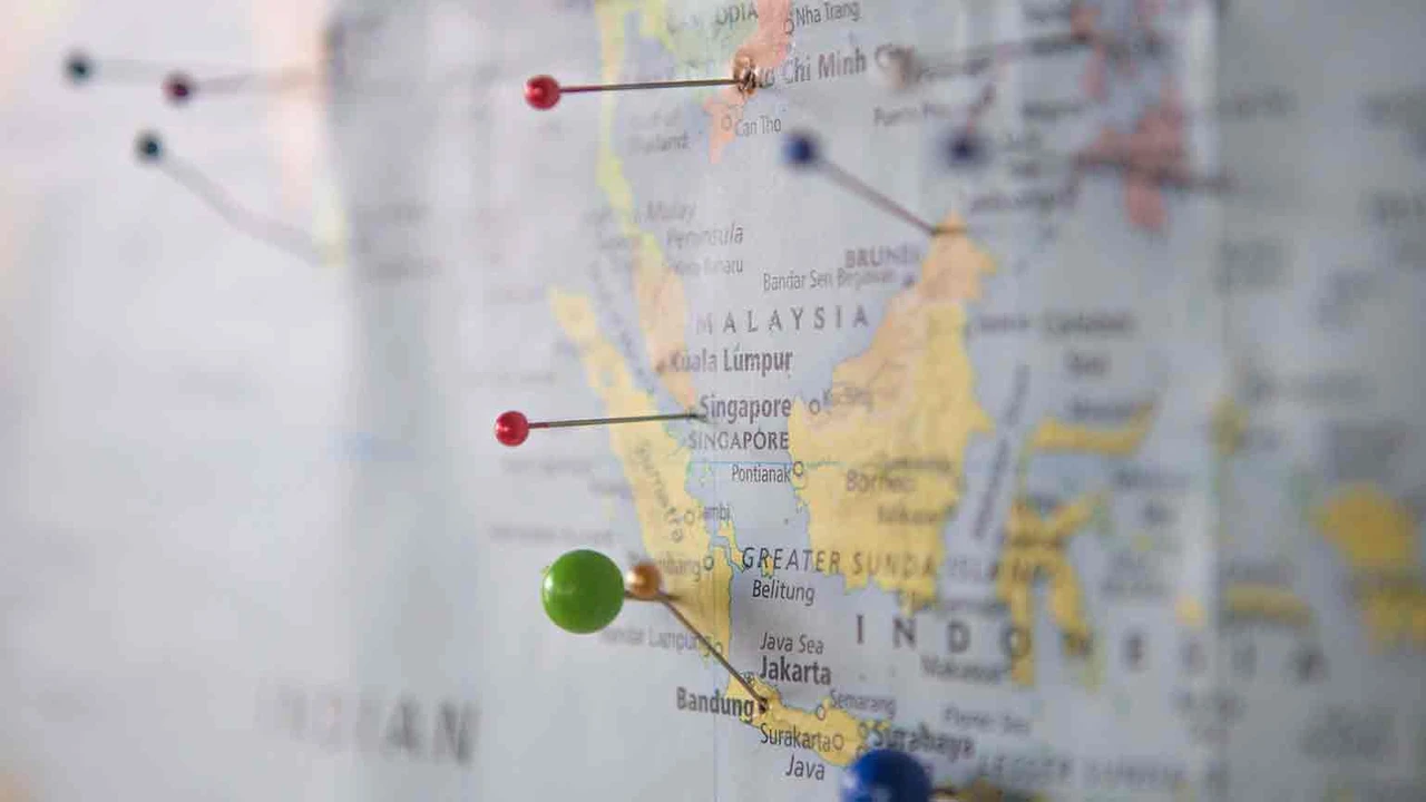 overhead view of corned beef sliced and on a platter with cabbage, potatoes, and carrots